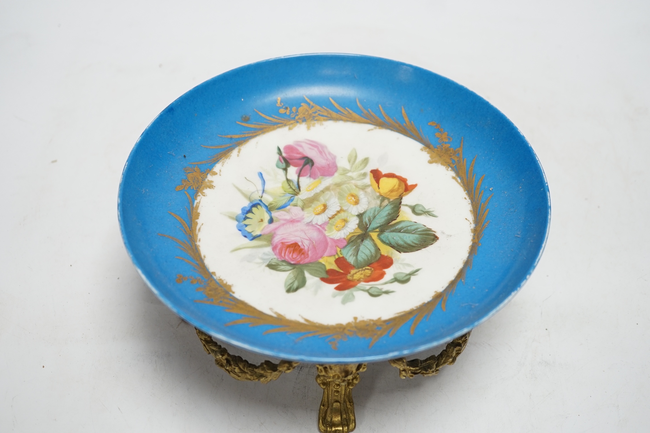 A Sevres style dish with ormolu mounted foot, 22cm diameter